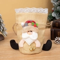 Christmas drawstring gift bag featuring a plush Santa Claus character and golden bells - Linen Santa Claus Style with Lace