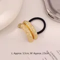 Minimalist elastic hair tie featuring irregular hammer-textured golden metal tubes - Lava Rock Double Row Gold