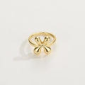 Close-up of 18K gold-plated adjustable ring featuring a polished clover leaf design - Gold Ring X