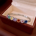 Detail of silver vintage branch texture cuff with seven colorful round gemstones and diamonds - Silver Tone Rainbow Gemstone Open Bangle (8#)