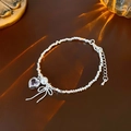 Silver beaded necklace featuring pink heart gemstone, pearl and bow charms on leather - Bracelet - Silver