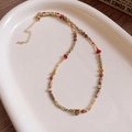 Macro detail of Bohemian beaded necklace with colorful stones and gold lobster clasp - 17# Bohemian Multicolored Stone Textured Beaded Necklace