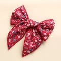 Detail of red floral cotton bow hair clip with intricate white and blue flower pattern - Red Floral