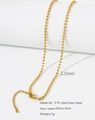 Detail of 2.5mm golden 316 stainless steel ball chain on a minimalist display - HC0033G2545-Round Bead Chain 2.5mm