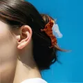Creative dachshund hair claw clip in amber tortoiseshell with blue glitter wings - Dachshund with Blue Wings (H1376)