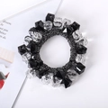 Detail of hand-woven hair tie with multifaceted black and clear beads on white background - 15# Black Transparent Beaded Hair Tie