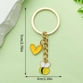 Golden bee keychain with yellow heart charm and dimensions showing a 7cm total length - Yellow Heart Bee Style (LS293)