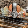 Bohemian hair comb featuring natural crystal pillars and a metallic triple moon goddess symbol - Black Wire Silver Moon