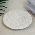 Natural irregular white quartz crystals arranged on a plate for decorative use - 100g Of Fluffy White Crystal (9-12mm)