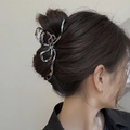 Silver liquid metal butterfly hair claw clip shown on model from a side-back view - Bowknot / 3D Bow / Large / Black
