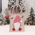 Christmas burlap gift bag with red striped gnome and festive music notes decor - Musical Note Tote Bag
