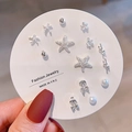 Detail of multi-style silver stud earring set with starfish and cherry charms on a white card - Silver Starfish Cherry (E0212-1)