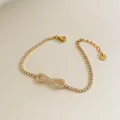 Golden stainless steel infinity tennis bracelet with white zircon and lobster clasp - Stainless Steel/Zirconia / Gold Infinity Symbol Style (SBK159)