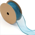 Detail of blue sheer fishtail chiffon ribbon on brown kraft roll for gift wrapping - Blue