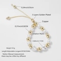 Detail view of two-tone beaded bracelet with gold copper beads, pearls and heart charms - Heart Pearl Style / Gold with Pearls and Hearts