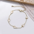 Golden delicate chain bracelet featuring five white enamel heart charms and clasp - White Heart Enamel Bracelet (0428-6 White)