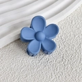 Detailed view of a matte dusty blue flower hair claw with a non-slip frosted finish - Dark Blue
