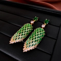 Detail view of gold feather earrings with green marquise stones and zircon pavé - No.11 925 Silver Needle Gold Green