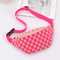 Close-up of pink checkered woven waist bag with golden zipper and adjustable strap - Pink