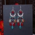 Detail of bohemian drop tassel earrings featuring colorful beads and crystal accents - Red Blue Silver