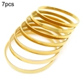 Set of 7 minimalist thin gold titanium steel bangles with a polished mirror finish - Inner Diameter 65mm / 5mm Gold (7 Rings)