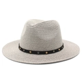 Detail of a beige woven Panama hat featuring a black band with gold and silver metal studs - M(56-58cm) / Gray