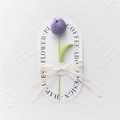 Detail of hand-knitted purple tulip flower tied with a Love Is Eternal ribbon bow - Bulb Tulip - Light Purple