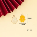 Detail of gingerbread man metal charms with yellow enamel finish for DIY jewelry - Gingerbread Man
