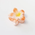 Detail of 8cm frangipani flower hair claw clip with orange gradient resin petals - Glossy Orange Yellow Gradient