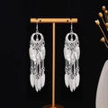 Bohemian silver tassel earrings with hollow round pattern and feather-shaped pendants - Hollow Ring Feather Tassel E4420
