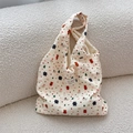 Detail of winter embossed tote bag featuring cute cartoon bears and Christmas motifs - Snowman Bear