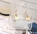 Summer transparent PVC jelly handbag with white inner pouch and golden hardware accents - White