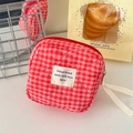 Quilted red gingham sanitary napkin pouch with a top zipper and woven wrist strap - Berry Red Plaid