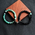 Detail of couple beaded bracelets with magnetic heart clasp on textured background - 1 Pair Pack / Matte Stone + Green Weathered