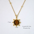 Macro shot of gold sun pendant necklace with tiger eye stone and detailed size measurement - Sun Pendant Necklace (17mm)