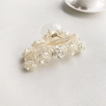Creamy white hair claw clip featuring an elegant 3D rose flower design on a white background - Camellia Hair Claw - White