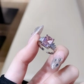 Macro detail of rectangle pink zircon flower ring with side diamonds on silver band - Pink Long Rectangle Open (JZ3886)