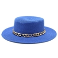 Detail of navy straw boater hat with a chic gold metal chain trim on white background - Sapphire Blue