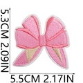 Detailed embroidery view of a pink bow patch with dimensions 5.3cm by 5.5cm - US 6