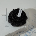 Realistic black rose shaped scented candle on stone base with detailed flower petals - Black