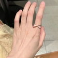 Adjustable rose gold butterfly ring with pink enamel detail worn on finger - Pink Twisted