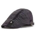 Detail view of the side buckle and M embroidery on this retro grey cotton flat cap - M Label Patchwork Style / Gray