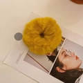 Bright yellow plush faux fur hair scrunchie shown on a stylish magazine background - Ginger Yellow