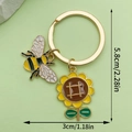 Golden bee and sunflower keychain pendant with size dimensions 5.8cm by 3cm - Bee Sunflower Combo