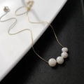 Elegant gold chain necklace with four graduated natural baroque pearls on a minimalist chain - 04-K25 Titanium Steel White Natural Pearl Necklace Gold 4-Bead