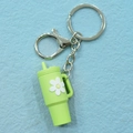 Fluorescent green mini water cup keychain with white daisy charm and silver metal clip - Keychain / Green Flower Cup Keychain