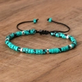 Woven bracelet featuring turquoise beads with black veins and silver spacer accents - No.36 Spiderweb Turquoise
