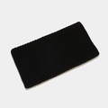 Detalle de textura de punto acanalado negro en una diadema deportiva sin costuras unisex - Negro