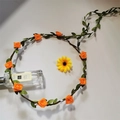 Bohemian floral headband featuring orange artificial roses on a green vine base - Orange