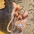 Brown Capybara spinning decision keychain with silicone wristlet and gold metal ring - Capybara Spinner - Dice